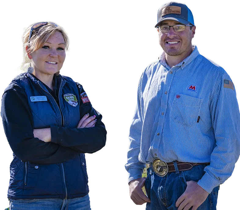 Two Marathon Pipe Line employees standing in a field together smiling